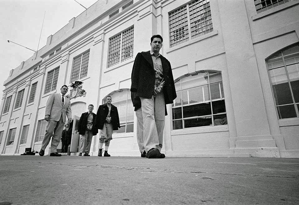 #20 Administration Building – Correctional Officer Jim Albright escorts the last twenty-seven convicts out of the Administration Building.