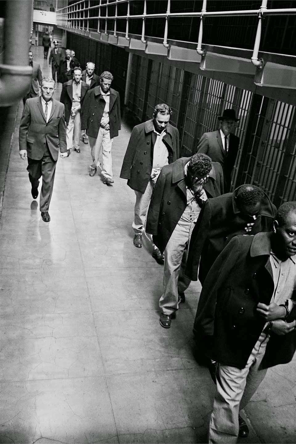 #5 Convicts on Broadway – Handcuffed, shackled and chained, convicts are marched out of United States Penitentiary Alcatraz.