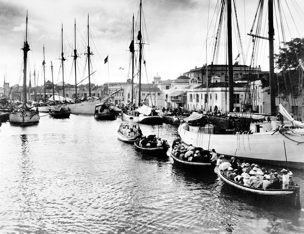 #3 The Inner Harbour of Bridgetown, Barbados showing tourists being taken out to deeper water to join their cruise ship, 1910.