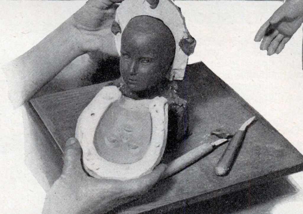 #5 When the clay model is completed, it is used in making a plaster-of-Paris mold as seen at the right.
