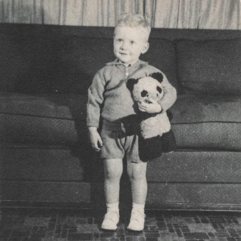 #22 Little boy holds a teddy bear, 1950s