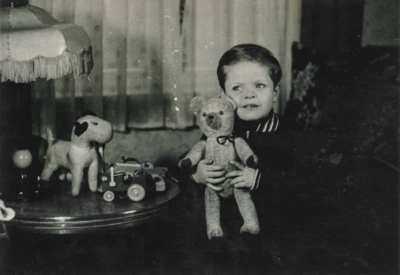 #35 Little boy holds his teddy bear inside