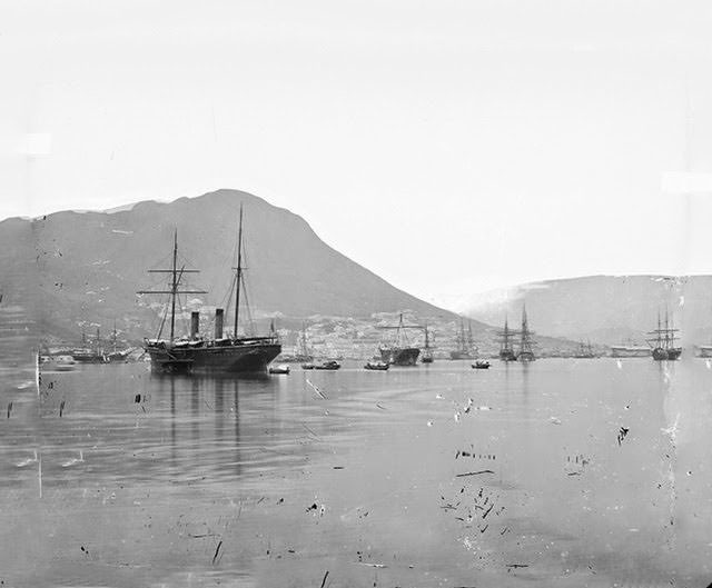 #12 Kellett’s Island, looking west or WSW across Wanchai towards Central and the Peak, with HMS Princess Charlotte, 1858