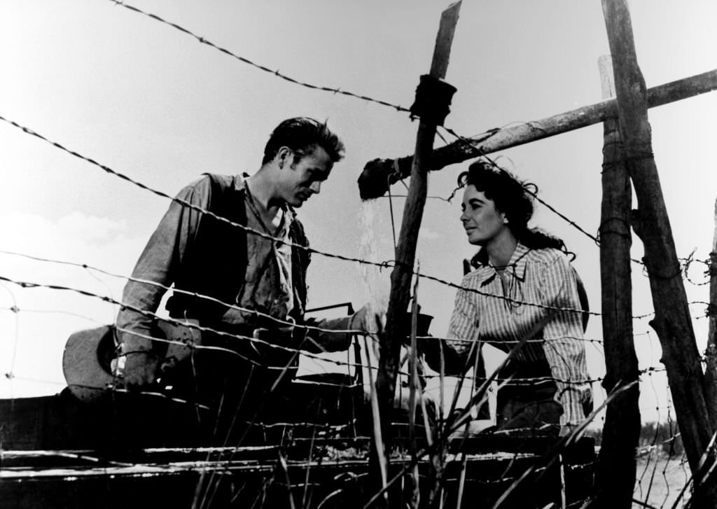 #25 Elizabeth Taylor with James Dean in a publicity still from the film “Giant” during 19556 in the USA.