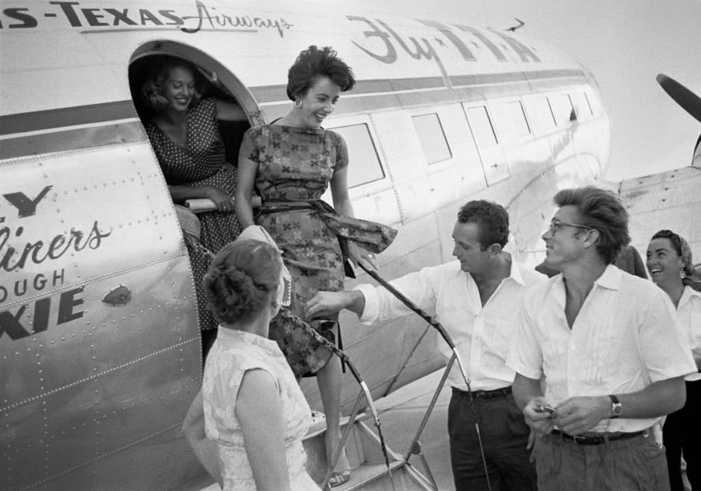 #38 James Dean Elizabeth and Tayor arrive by plane to take a weekend break.