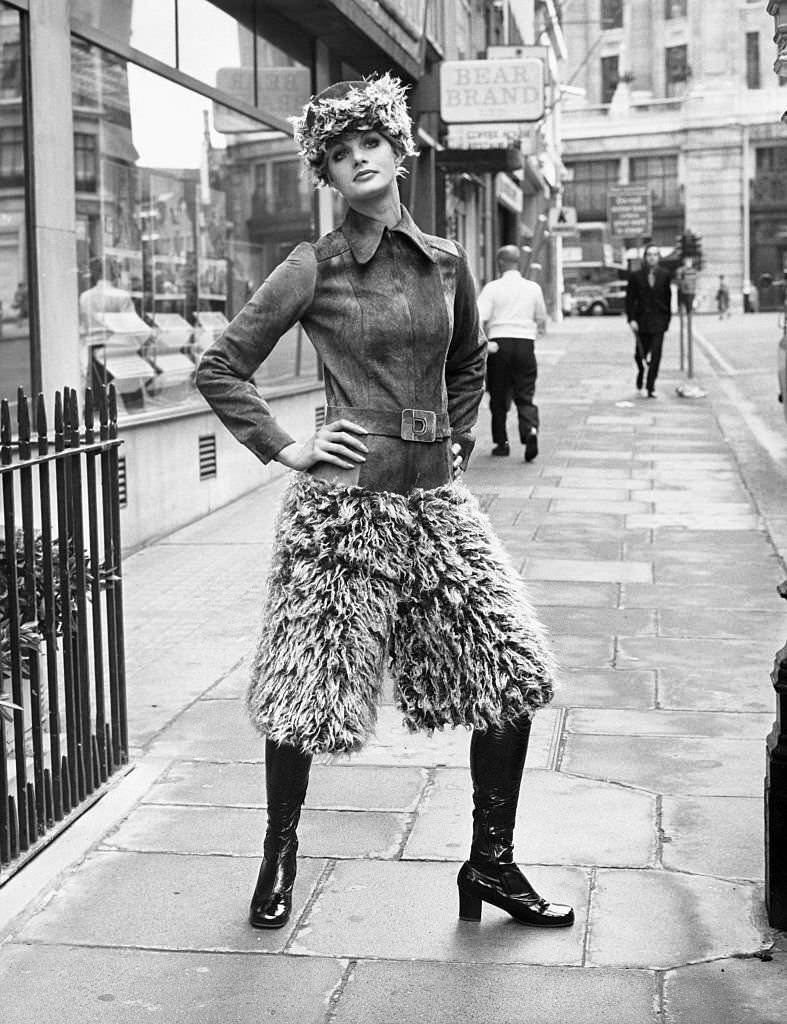 #22 A model wears a belted, fake fur, and Gaucho pant.