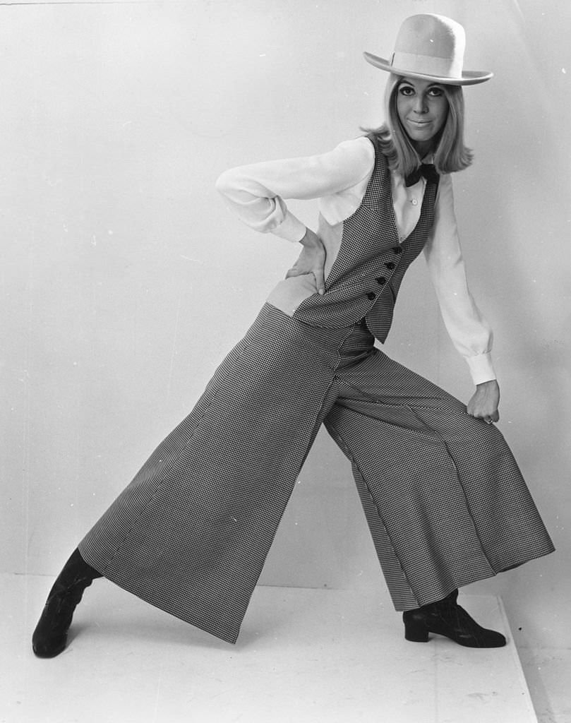 #7 Mary Quant’s wide-legged trouser suit with waistcoat and cowboy hat.