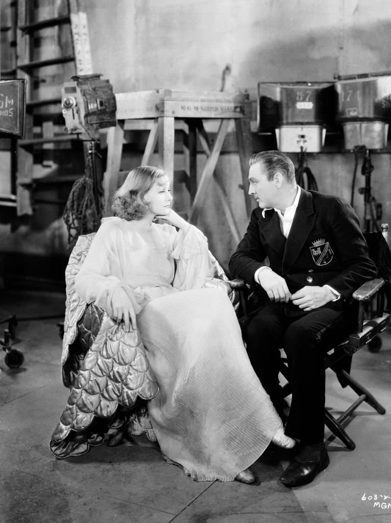#39 John Barrymore (and Greta Garbo chatting on the set of ‘Grand Hotel’, 1932