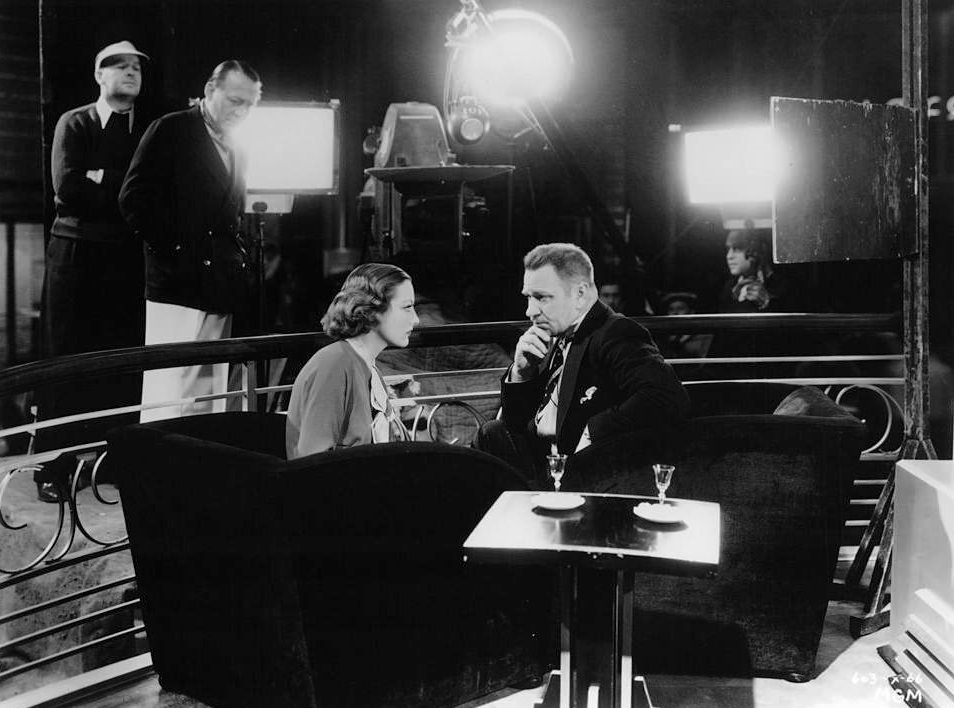 #54 Joan Crawford and Wallace Beery during the filming of ‘Grand Hotel’, 1932.