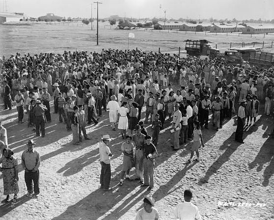 #14 A large group of Japanese American detainees at an assembly center awaiting transportation to a relocation center.