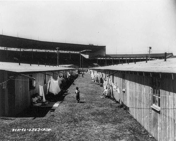 #3 Rafters from barrack buildings make convenient extensions for a clothesline at Puyallup Assembly Center.