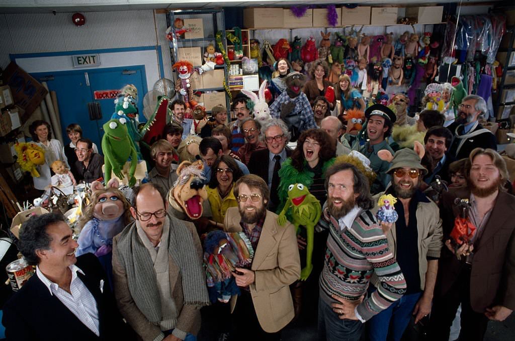 #12 The artists and crew behing the television program The Muppet Show, created and produced by Jim Henson (front, 3rd from L).