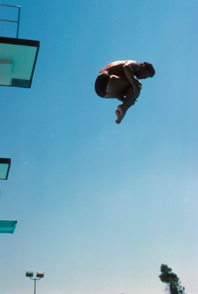 #35 Greg Louganis in action from high dive at Mission Viejo International Swim Complex.