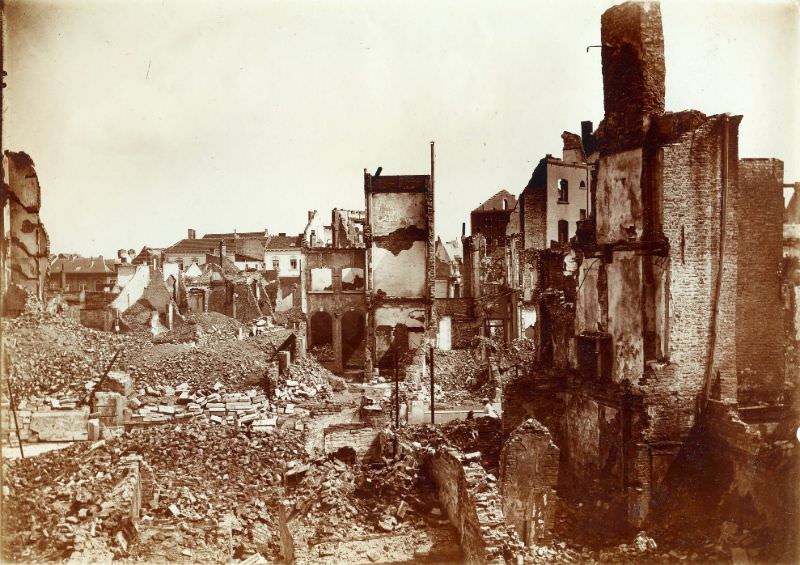 #25 Rubble near twin towers and velocipede shop, Leuven, August 1914