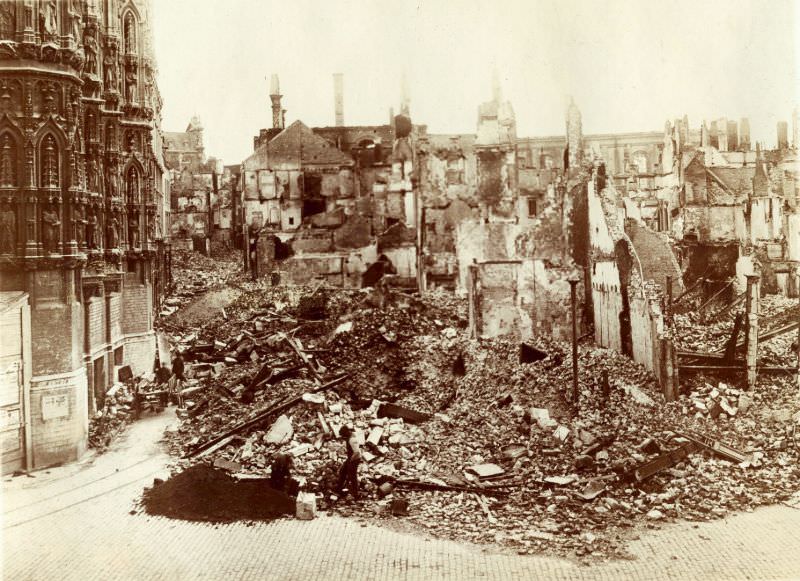 #2 Block of houses between Naamsestraat and Kortestraat completely destroyed. City Hall is on the left, Leuven, August 1914