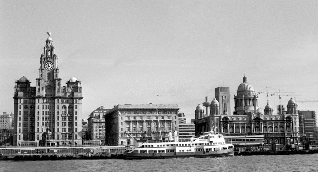 #30 Royal Liver Building in Liverpool, left, with the Mersey ferry on its way along the River Mersey.