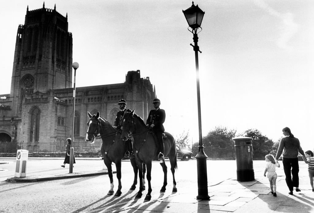 #17 Police mounted on horses patrol the area around Liverpool Anglican Cathedral, 6th September 1989.