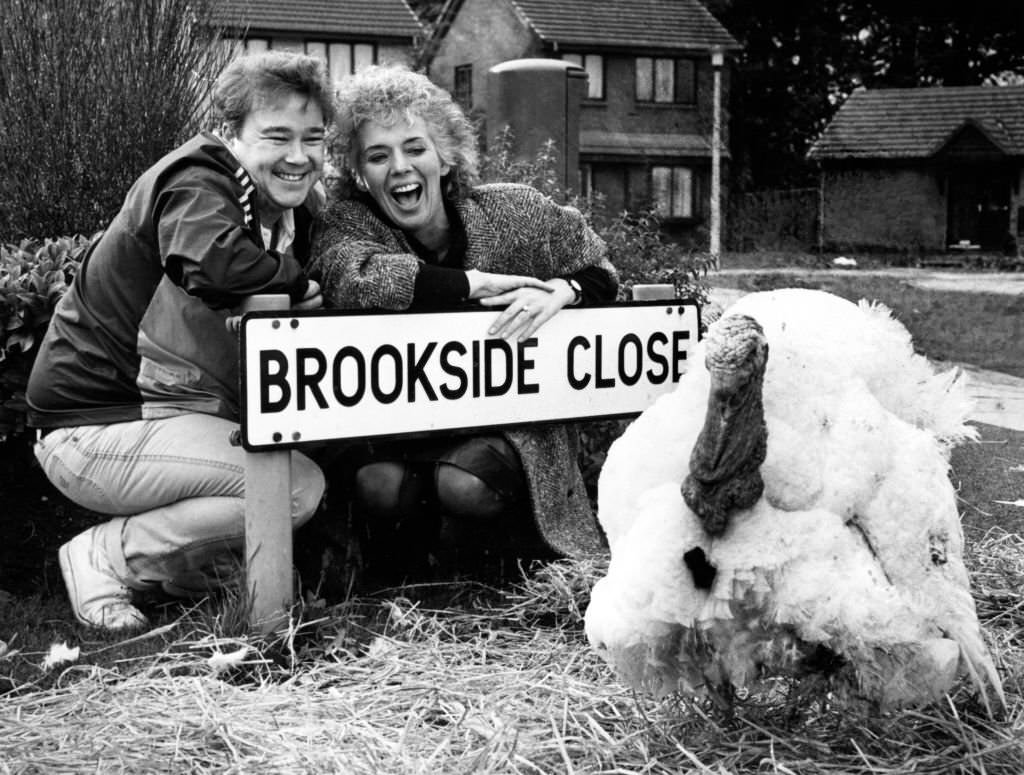 #115 Michael stark and Sue Johnston from the Brookside cast with Trevor the Turkey, 6th November 1985.