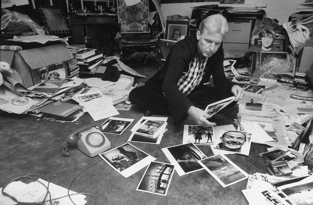 #125 Photographer Mike McCartney, brother of Paul McCartney, at home going through photos.