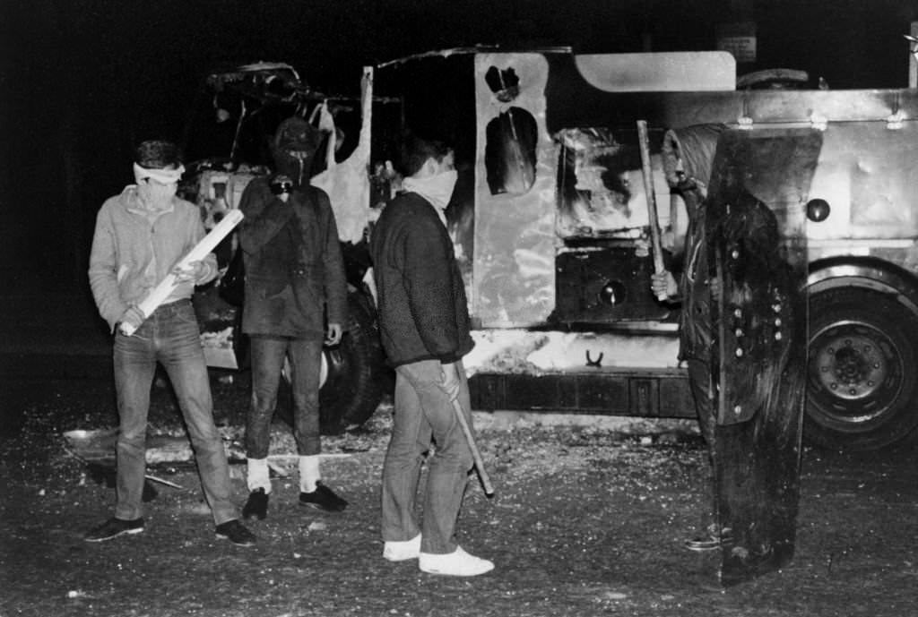 #154 Protesters armed with sticks during the Toxteth race riots in Liverpool, July 5, 1981.