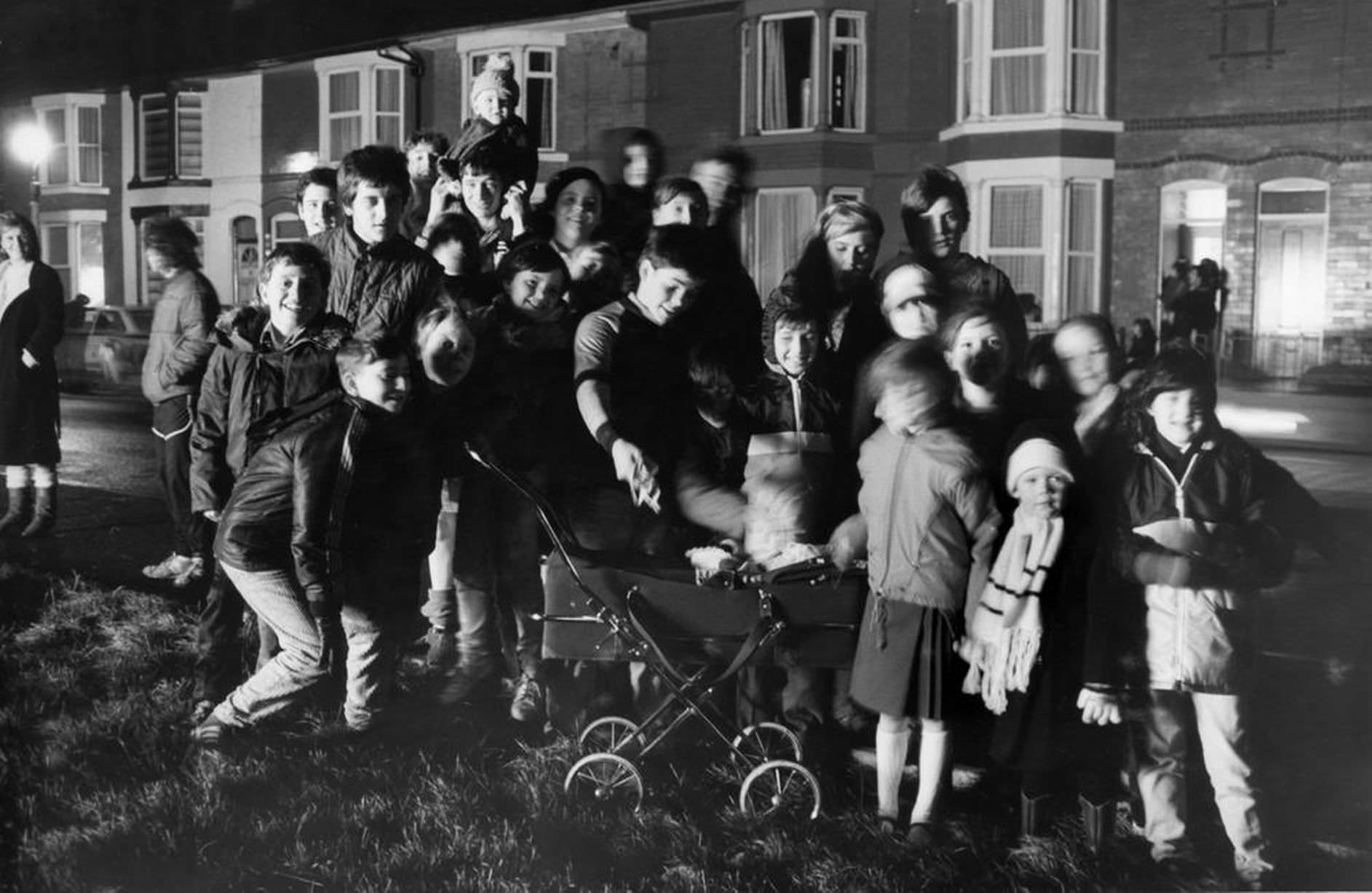 #14 Residents of Hornby Boulevard, Bootle gather to watch a private bonfire and fireworks display, 5th November 1987