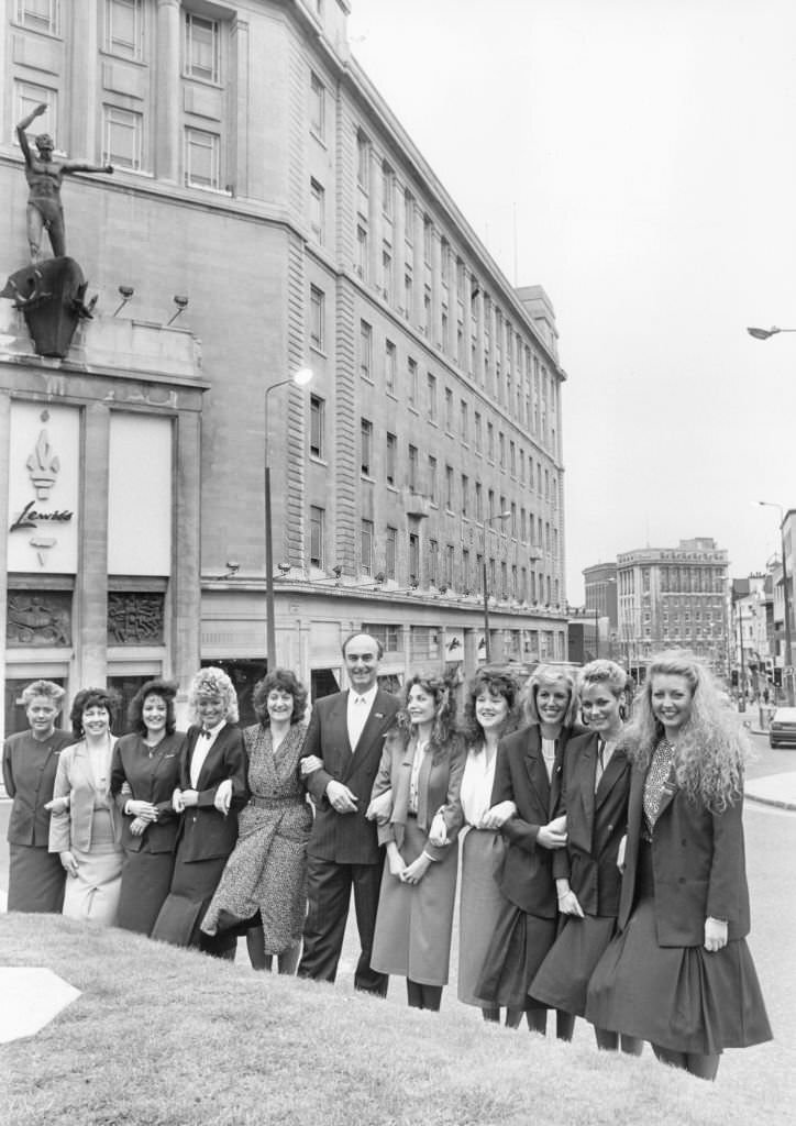#167 Lewis’s store manager David Cameron with some of the sales assistants on the day that the Sears group sold off the Liverpool Department store, 1988