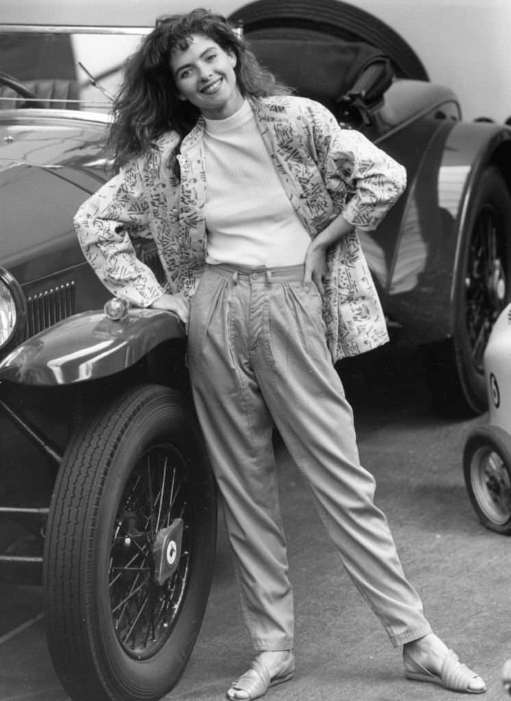 #172 Model wears apple green trousers with green white pattern jacket standing beside a 19-29 Lancia Lamda. 9th June 1986.