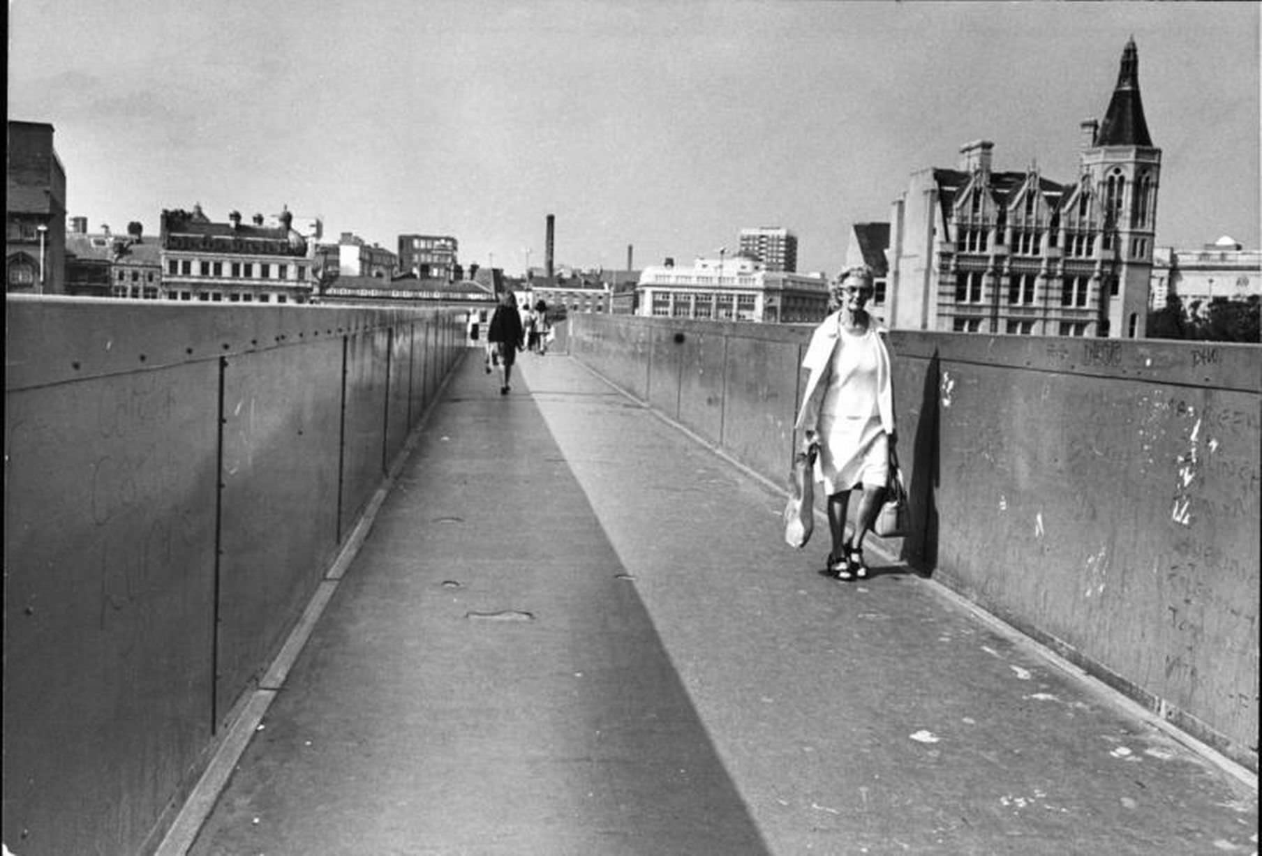 #39 Picture shows pedestrians using the walkway, also known as the sky bridge, in Roe Street, Liverpool city centre.