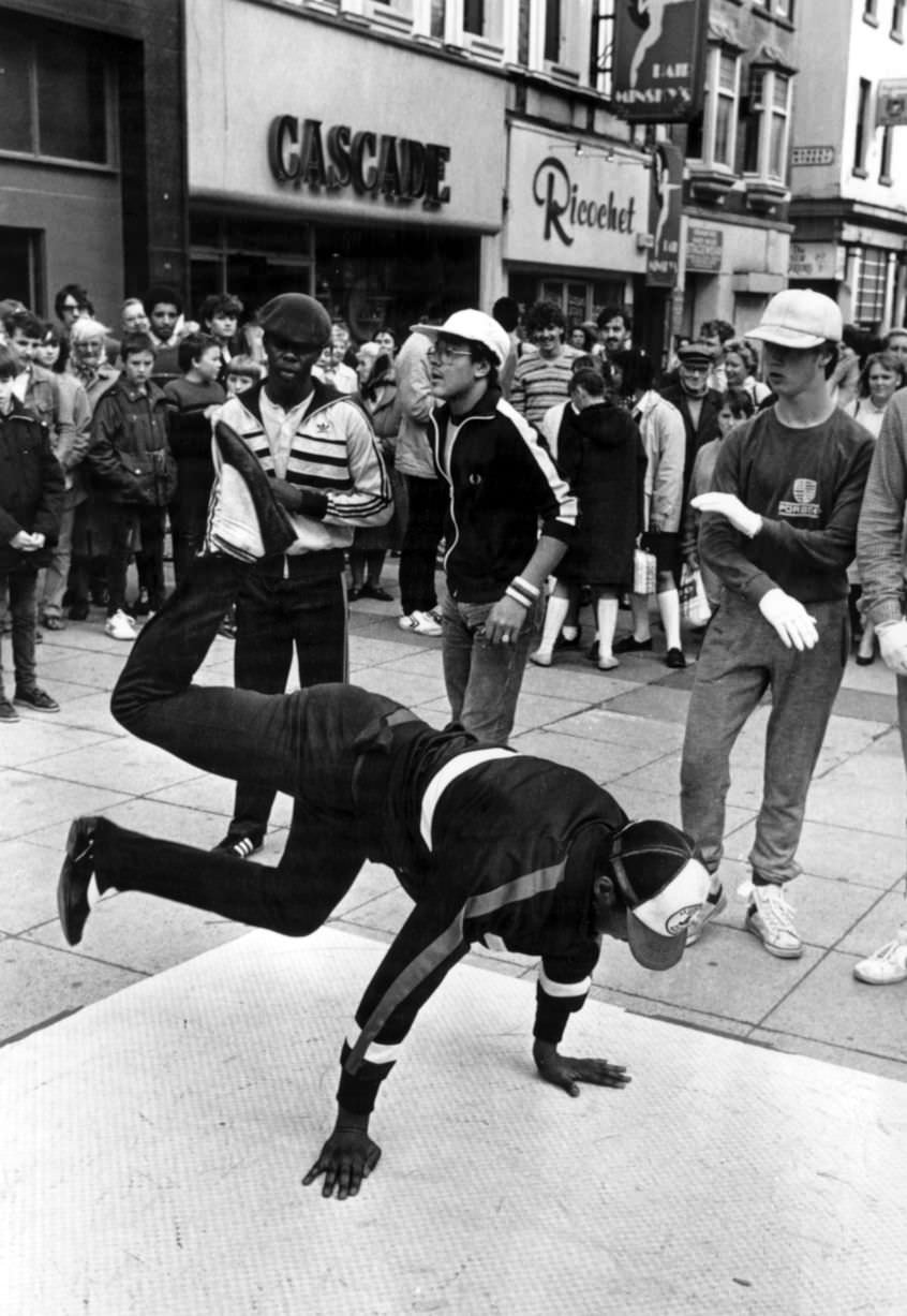 #44 Street dance crew Broken Glass, in Clayton Square, Liverpool, demonstrating their moves, 6th October 1983