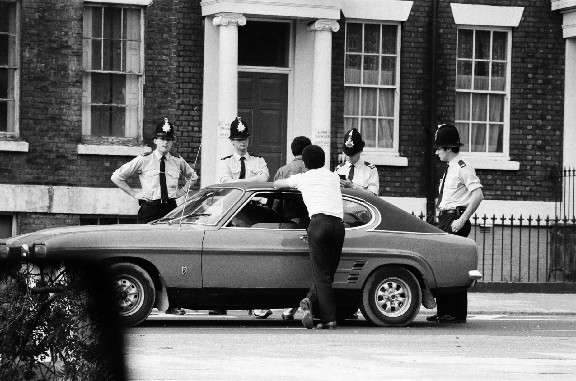 #53 Life in Toxteth, Liverpool, is one of despair for the unemployed. Black youths are stopped and searched by Police a few days after the Toxteth riots, 9th July 1981