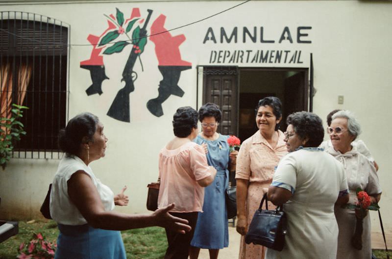 #10 Doña Mercedes greets her friends at the AMLAE meeting house, Managua, Nicaragua, 1985