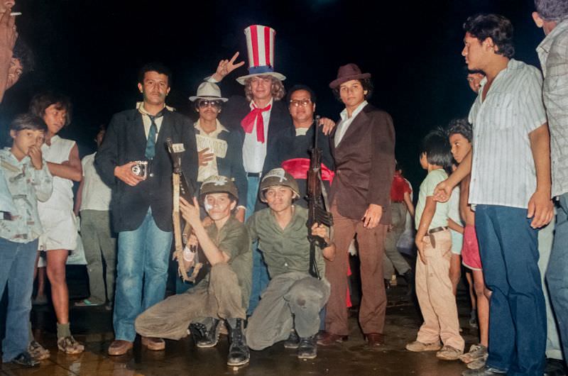#18 Celebration of the 6th anniversary, students dressed up at CIA, Contra-soldiers and Catholic priests to mock the opposition to the revolution, Managua, Nicaragua, 1985