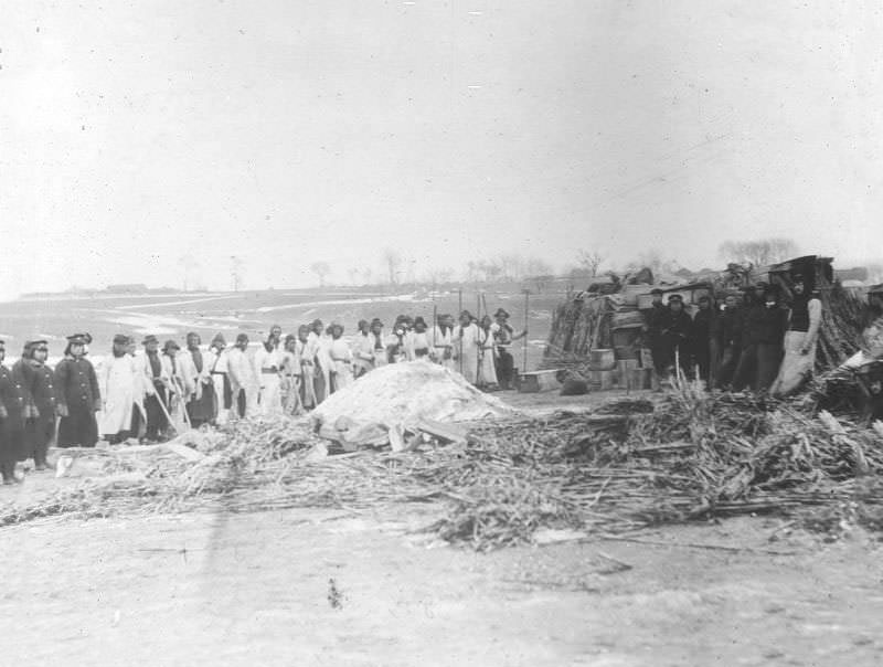 #22 Stacks of unburned coffins and pile of ashes covered with lime, Changchun