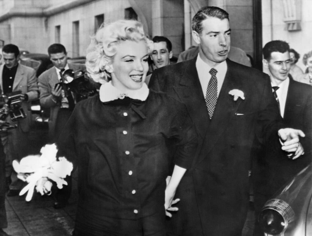 #15 Joe Di Maggio and Marilyn Monroe leaving the city hall of San Francisco after their wedding.