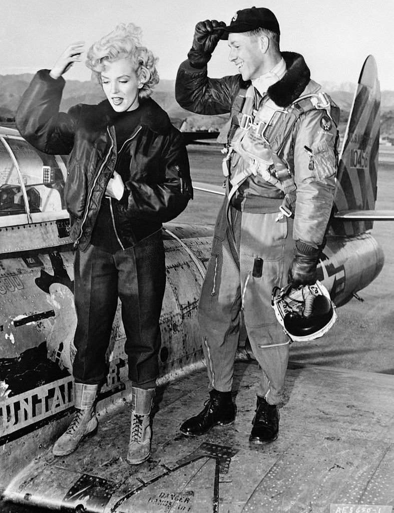 #16 Marilyn Monroe talking with Lieutenant.
