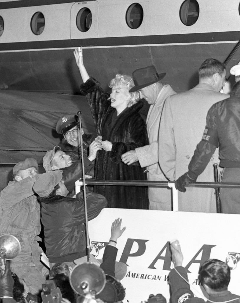 #21 Marilyn Monroe and Joe DiMaggio are seen on arrival at the Imperial Hotel on February 1, 1954 in Tokyo.