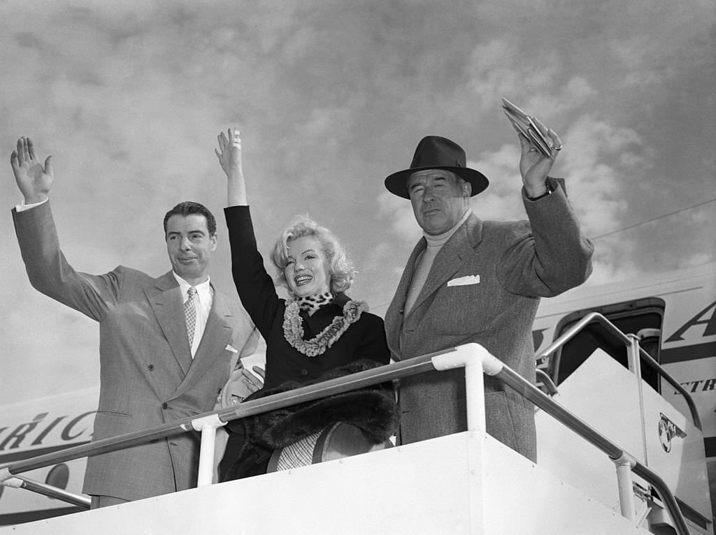 #24 Marilyn Monroe and Joe DiMaggio waving from Plane, 1954