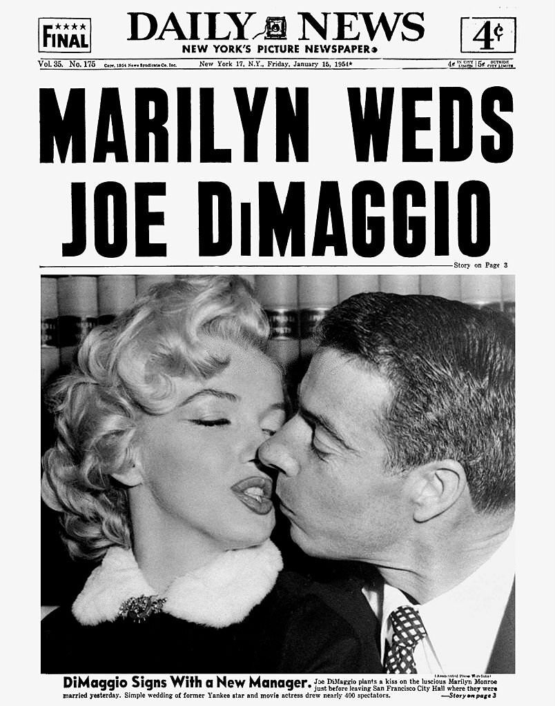 #2 Joe DiMaggio plants a kiss on the luscious Marilyn Monroe just before leaving San Francisco City Hall.