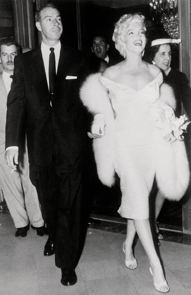 #30 Marilyn Monroe Walking with Husband Joe DiMaggio.