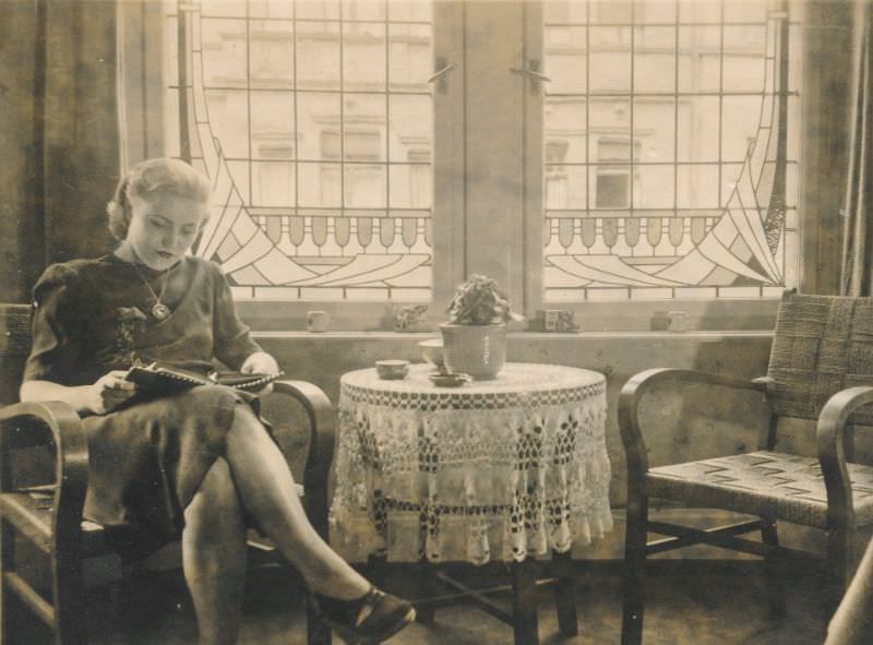 #11 Beautiful woman reading while having tea, circa 1930s