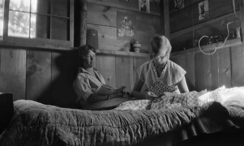 #15 Two women inside a rustic cabin, circa 1930s