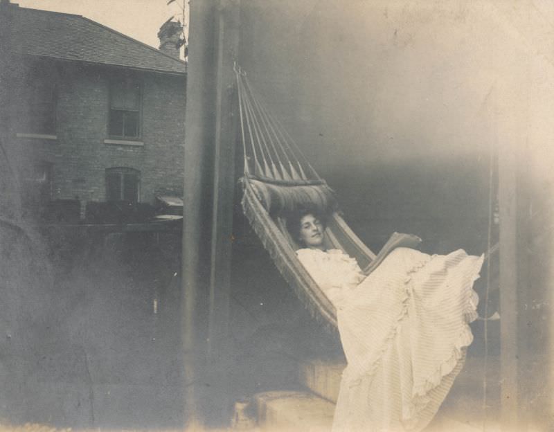 #2 Woman rests in a large hammock, circa 1900s