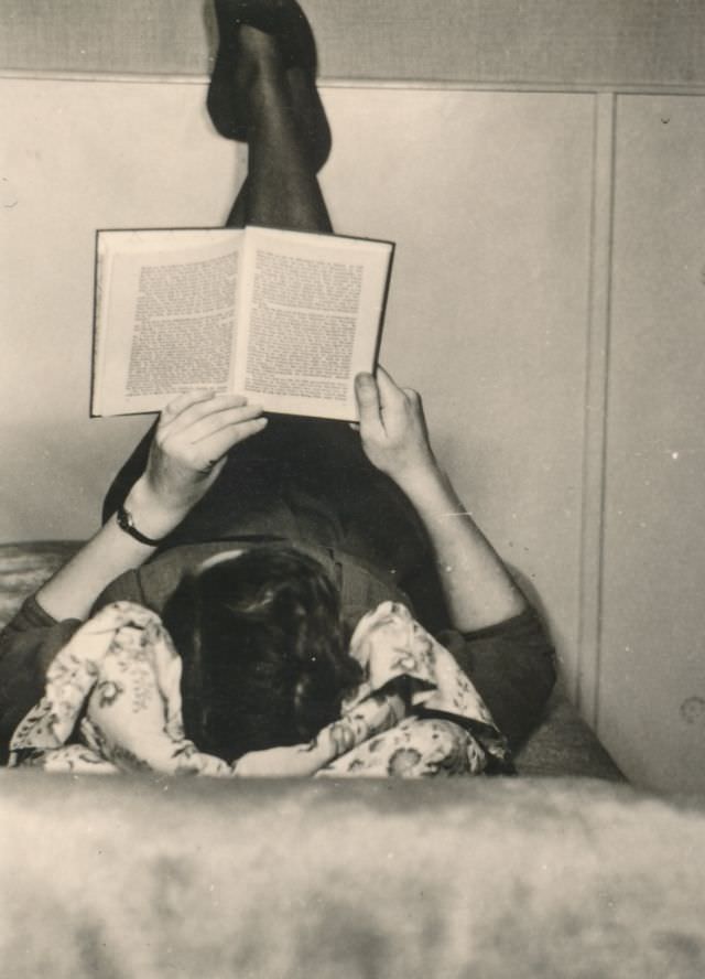 #33 Woman reading a book in bed