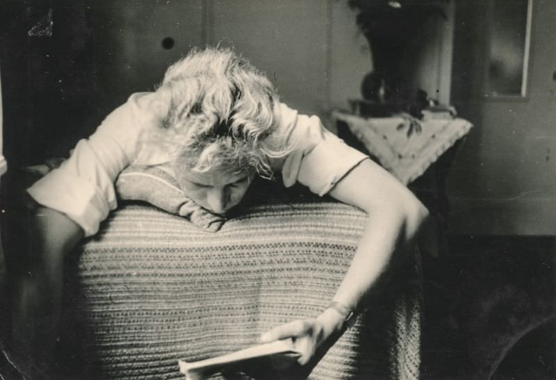 #36 Young man reading while lying down