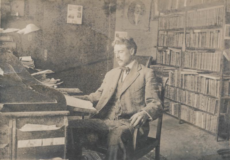 #6 Man sits in his library, June 29, 1912