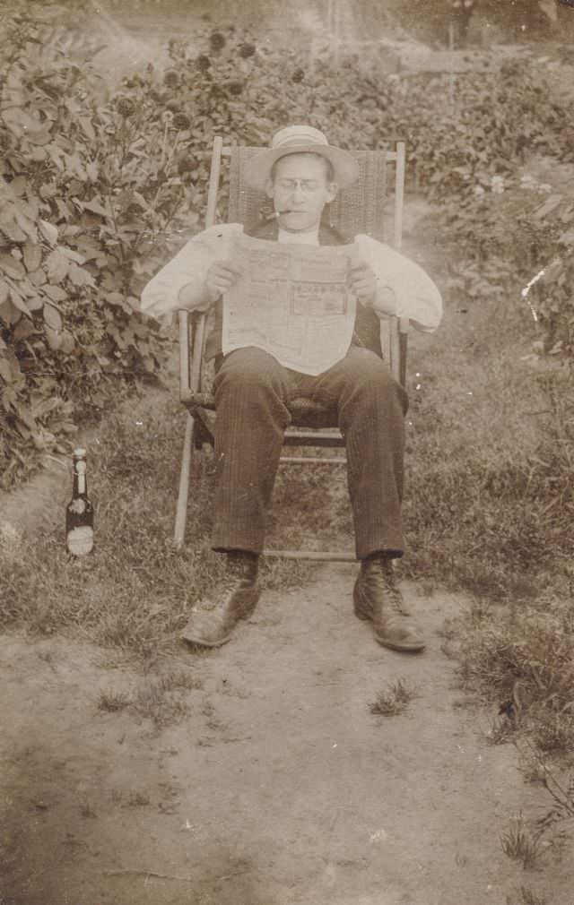 #9 Man reading the newspaper outside, circa 1920s