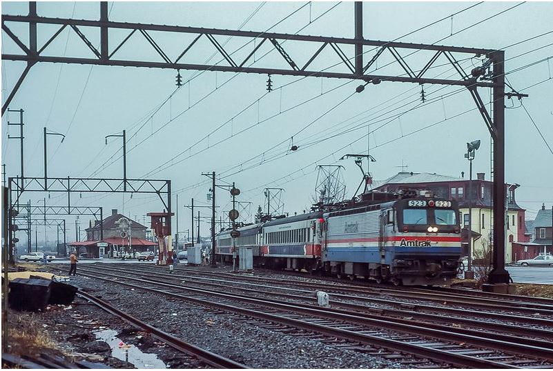 #79 SEPTA’s AEM7 test train has been reconfigured to point south, and is now leaving Lansdale to return to Philadelphia, 1980s
