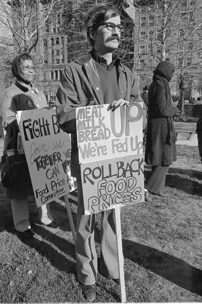 #27 A demonstrator with a sign during an anti-inflation rally in Independence National Historical Park, Philadelphia, October 1984.