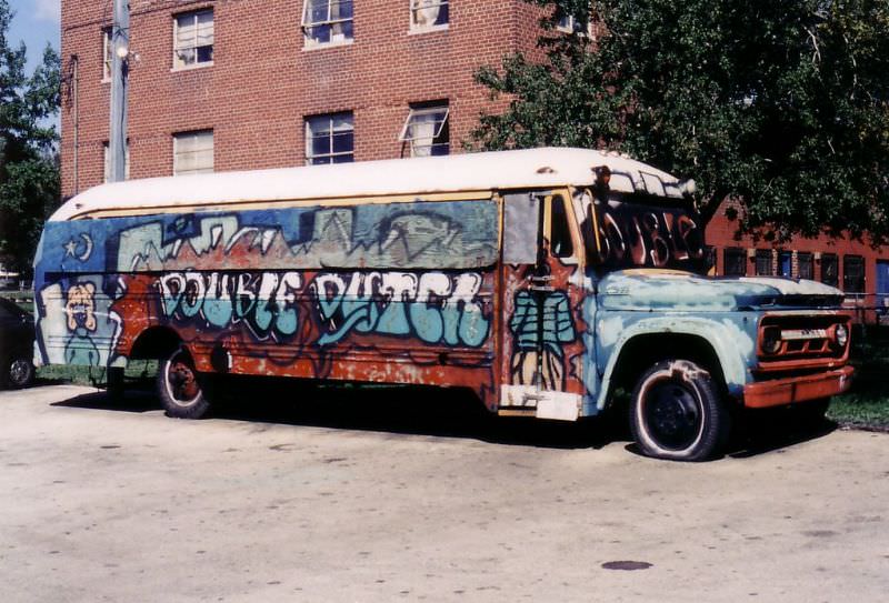 #106 A 1962 Chevy school bus sitting outside the projects in North Philly in the Summer of 1985