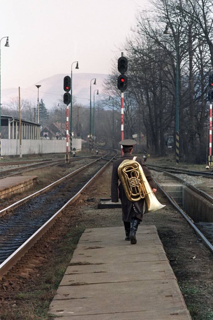 #51 A Soviet soldier carrying a tuba returns th his barracks in Frenstat, 350 kilometers east of Prague.